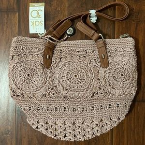The Sak hand crocheted pink bag